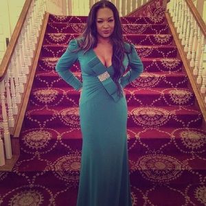 Jovani Emerald Green Gown   V shaped in the back.